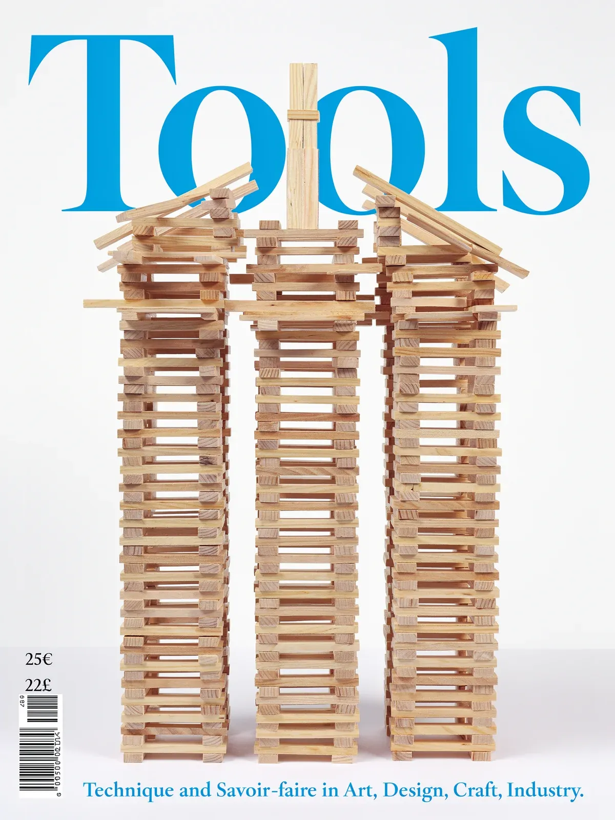 A magazine cover with the blue headline Tools above three towers of stacked wooden planks.